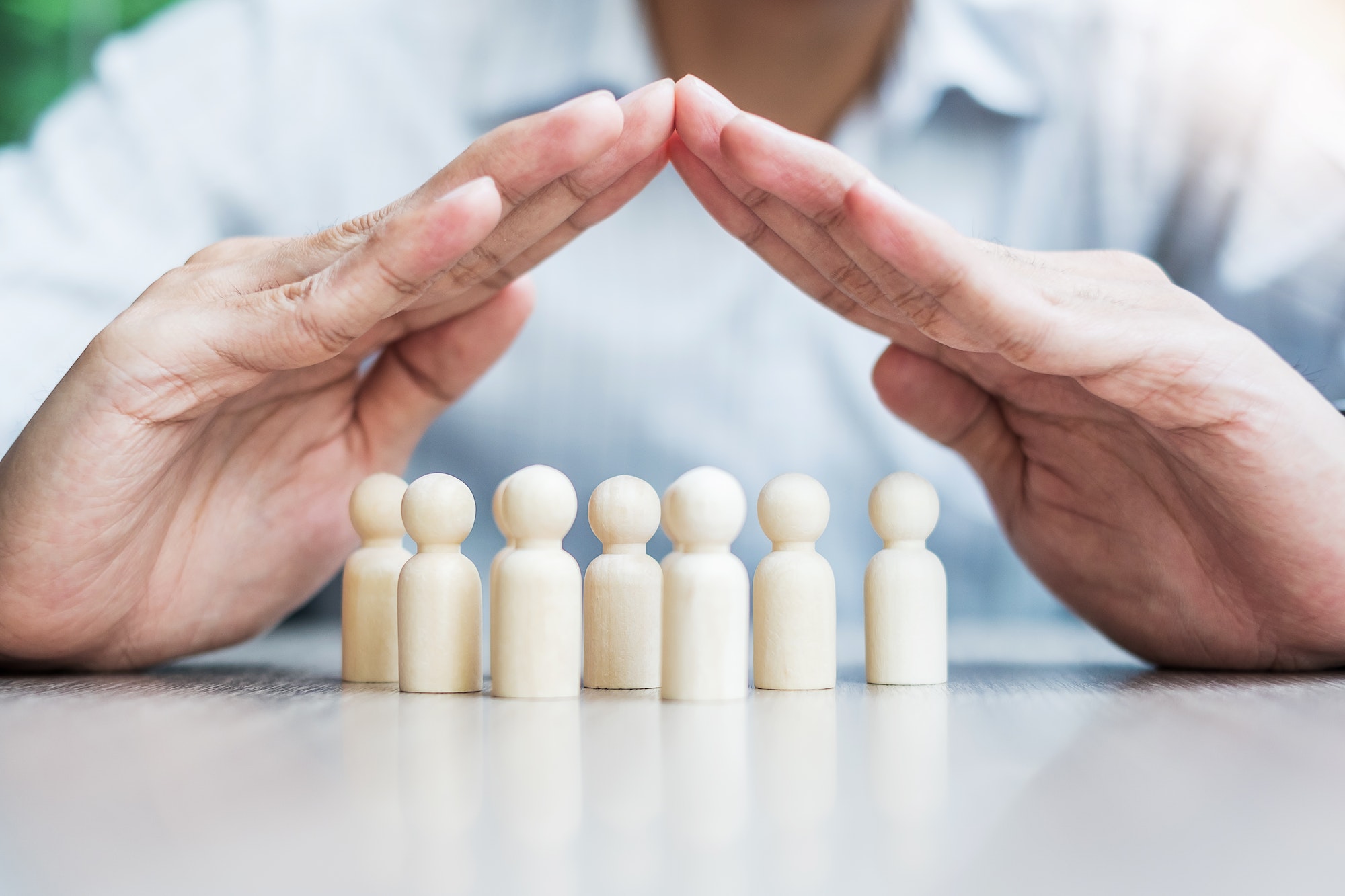 Businessman hand cover man wooden from crowd of employees. People, Business, Human Resources