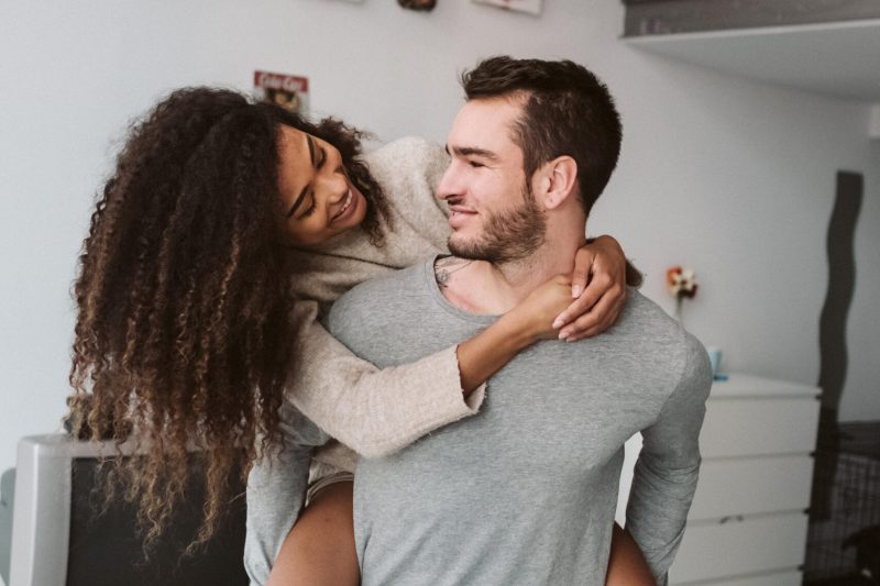 Multiracial couple having fun at home